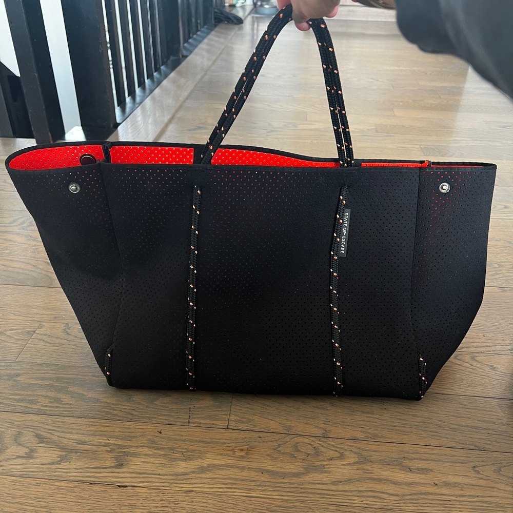 Stylish Black Tote with Red Interior